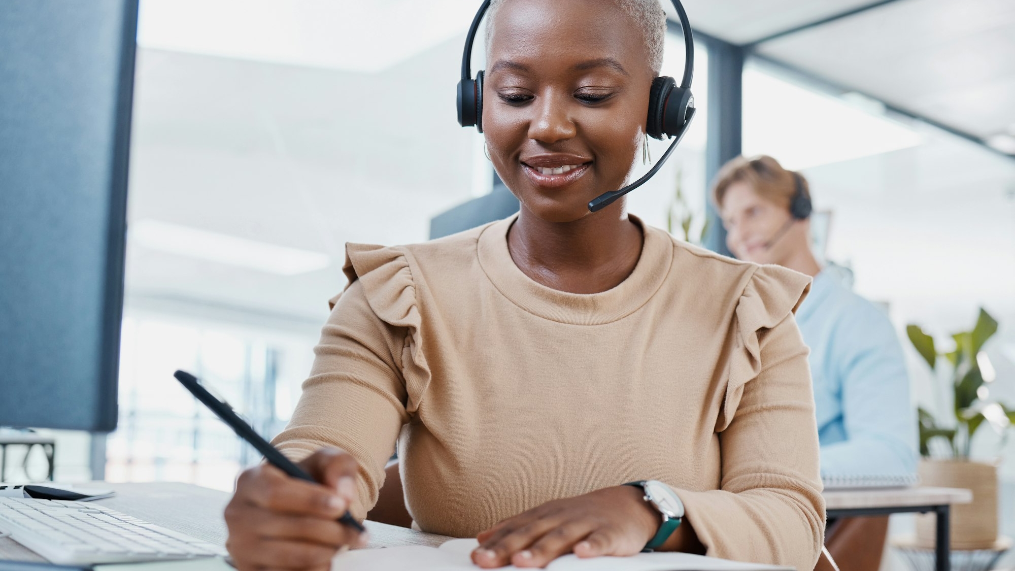 CRM, notebook and planning telemarketing consultant woman writing strategy, solution or idea with s
